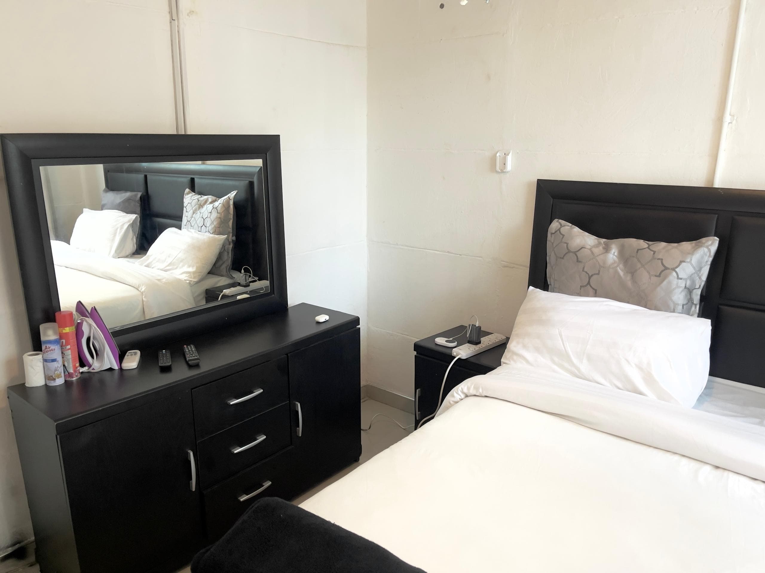 Majestic Haven — Bedroom layout with mirror dresser at Majestic Haven