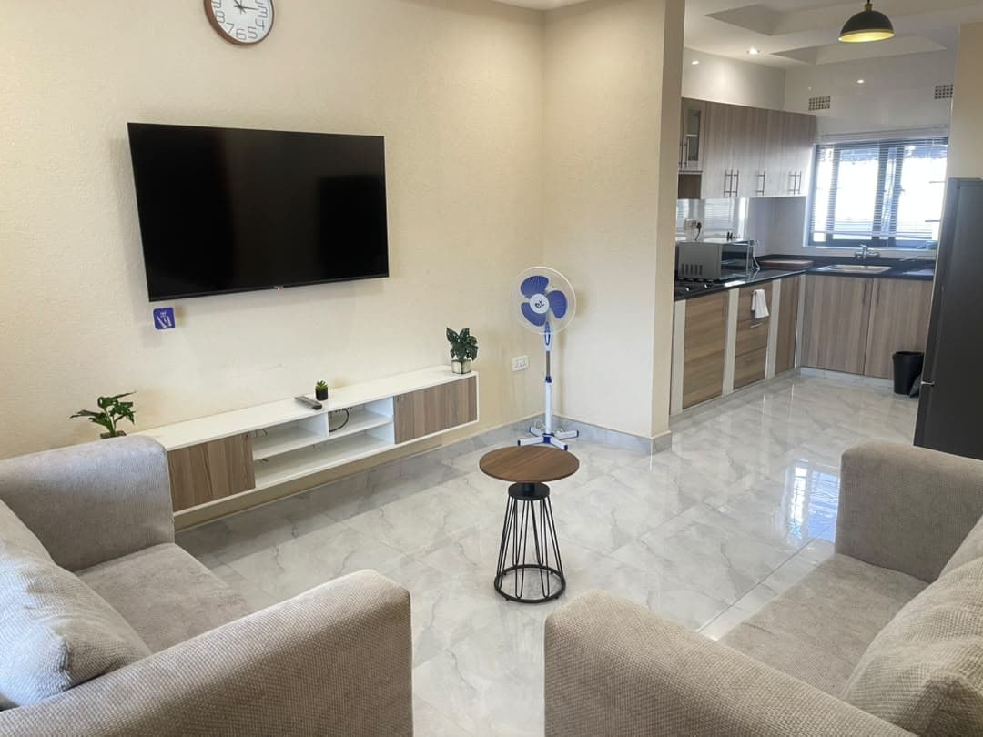 Parklands Apartments Livingstone — Apartment A — open-plan lounge, smart TV & natural light