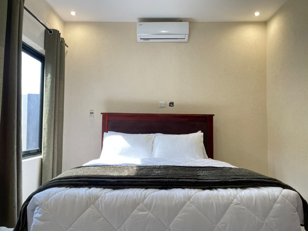 Parklands Apartments Livingstone — Air-conditioned main bedroom