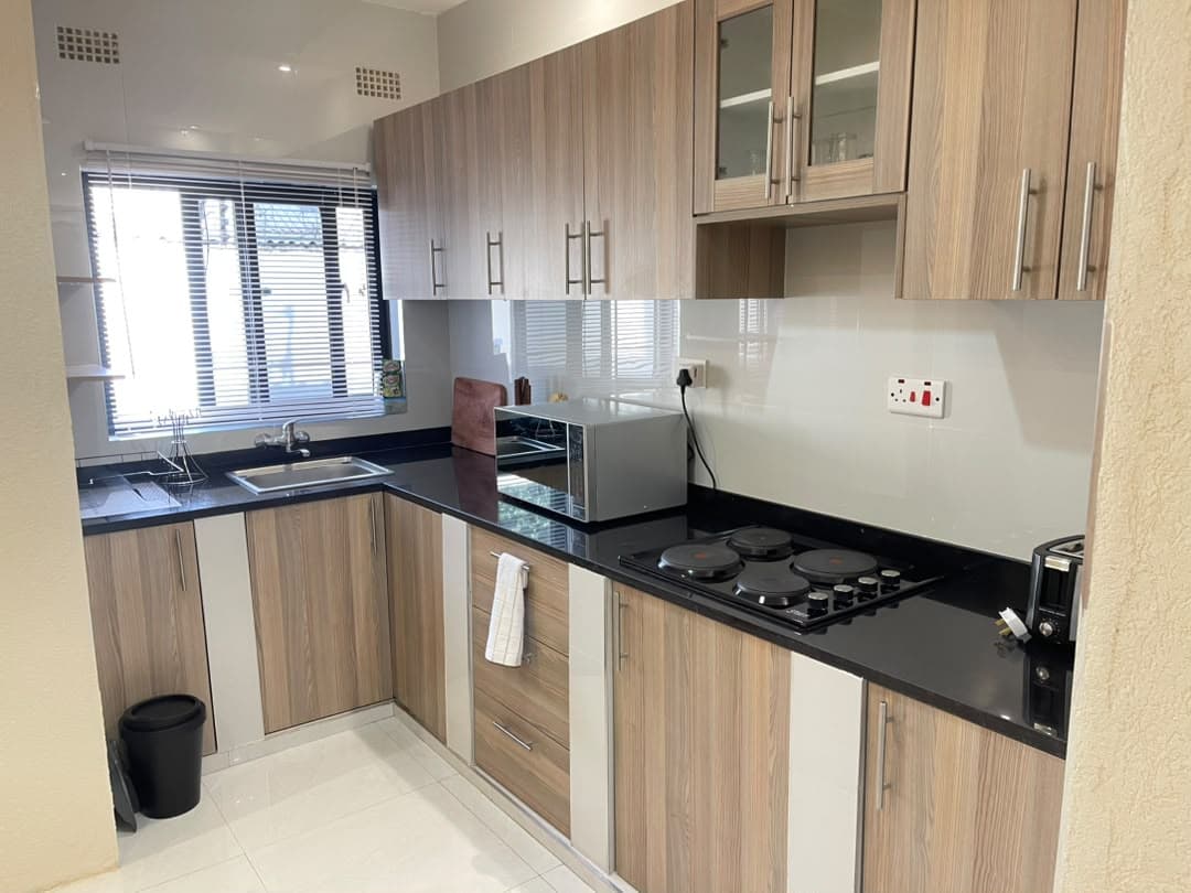 Parklands Apartments Livingstone — Apartment B kitchen — full self-catering setup