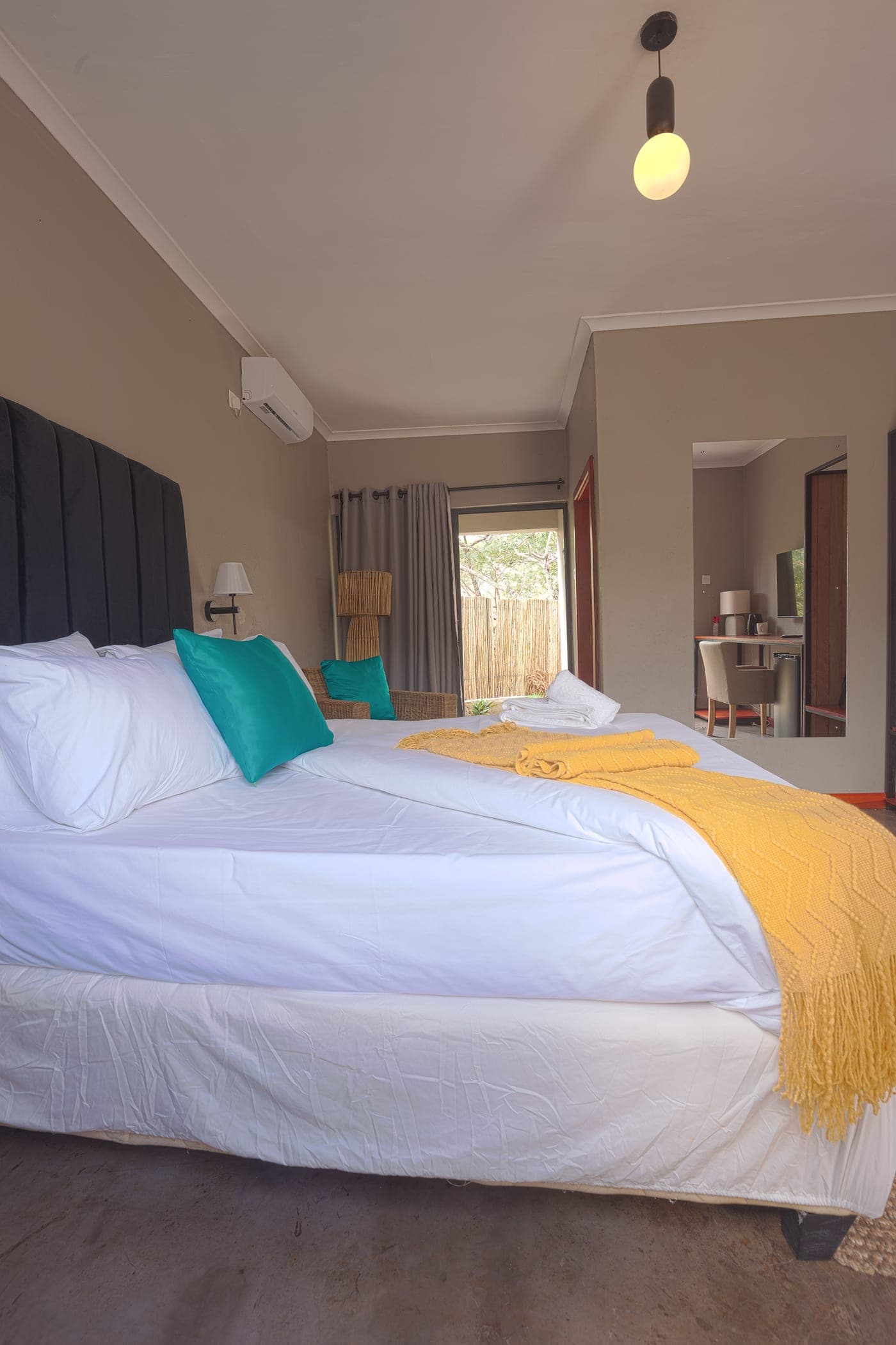 Kosha Lodges — Bedside detail in a Koshalodges room