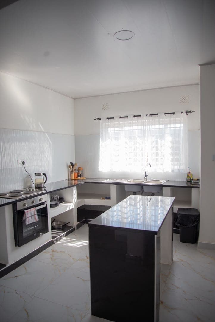 Bonazazi Apartments — Fully equipped kitchen — cookware, fridge & prep space